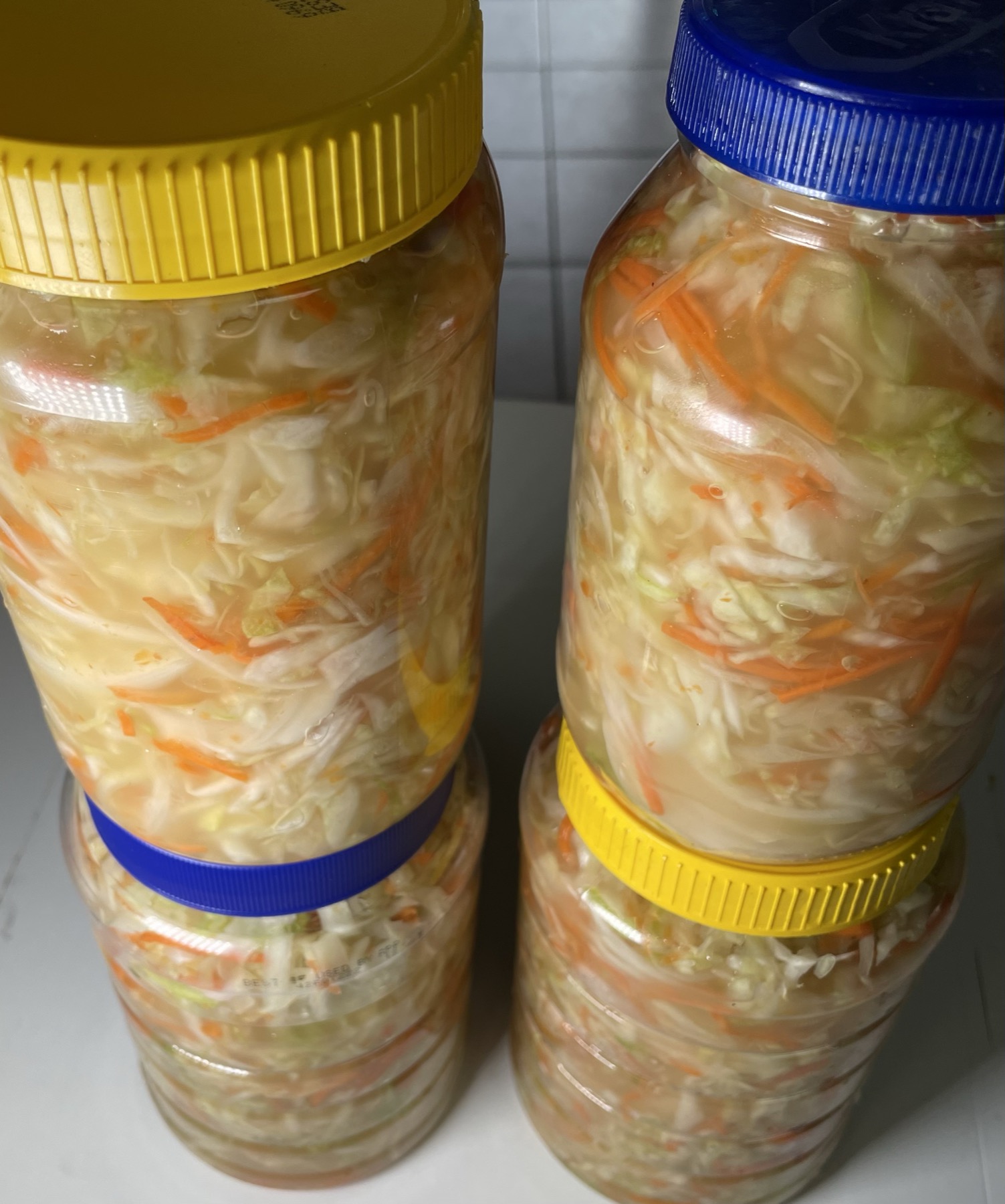 Jars of our signature house-made Haitian pikliz